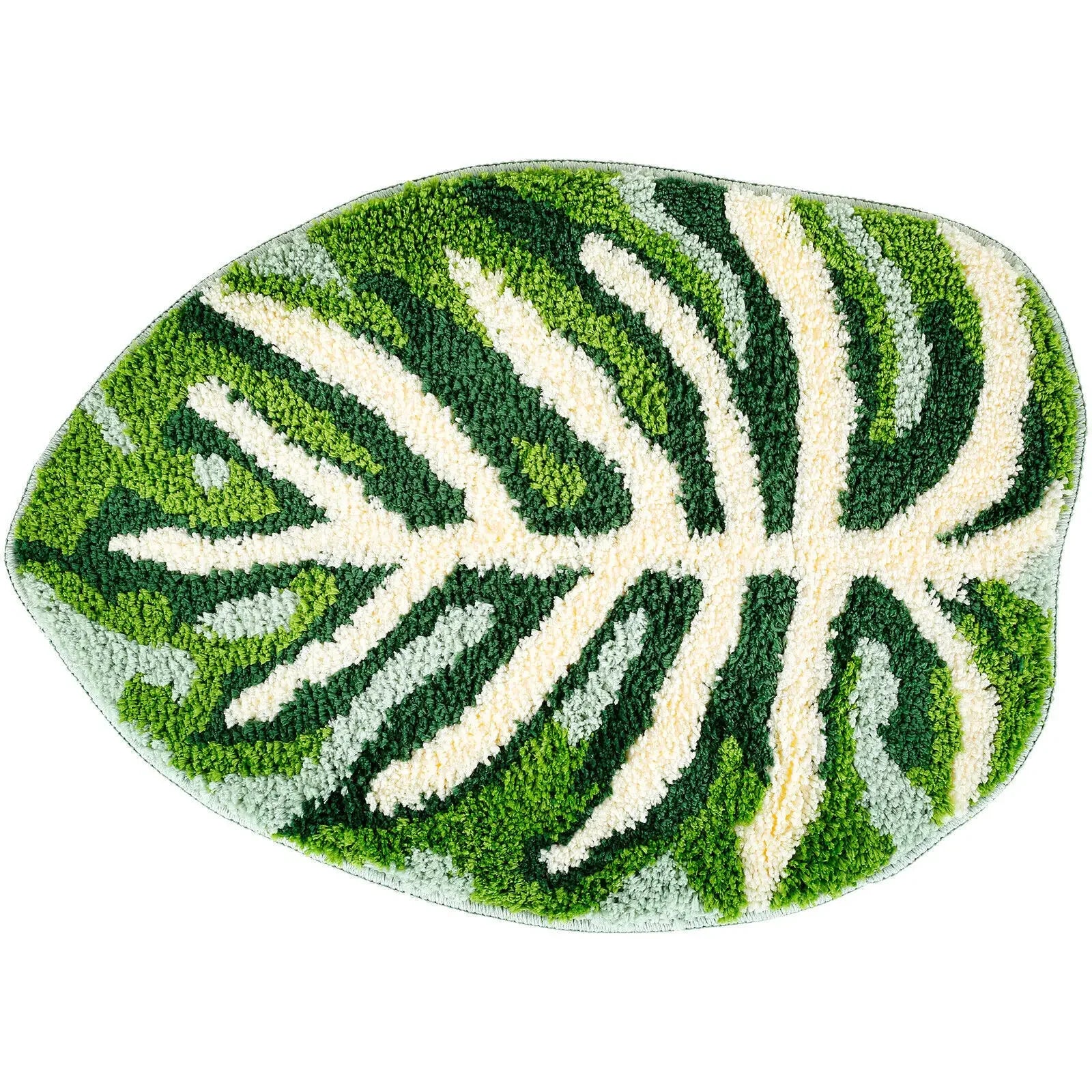 An oval-shaped rug with a white background featuring a detailed tropical monstera leaf pattern in various shades of green. The leaf design includes prominent veins and sections, giving the rug a natural and vibrant appearance.